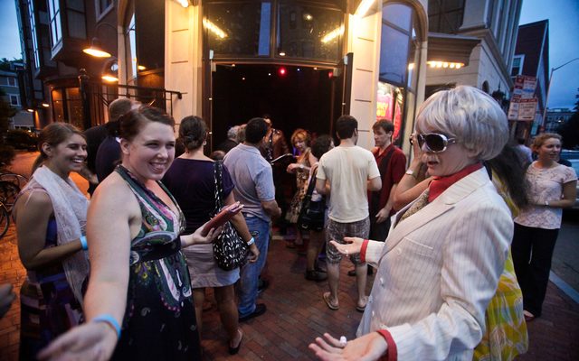 Mr. Oberon greets guest outside the theater.