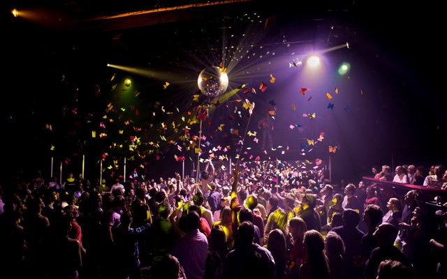 Butterflies fall over the crowd at The Donkey Show.