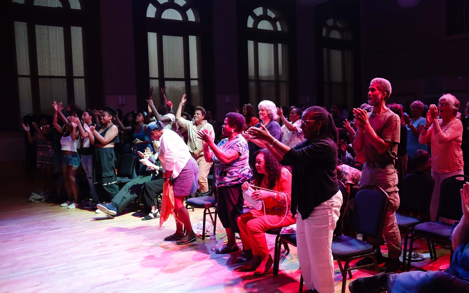 Audience members applauding at Hibernian Hall on August 16, 2018.