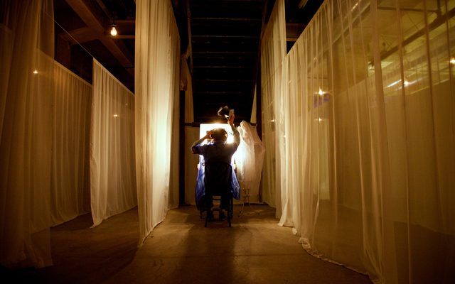 Audience member participating in The Garden