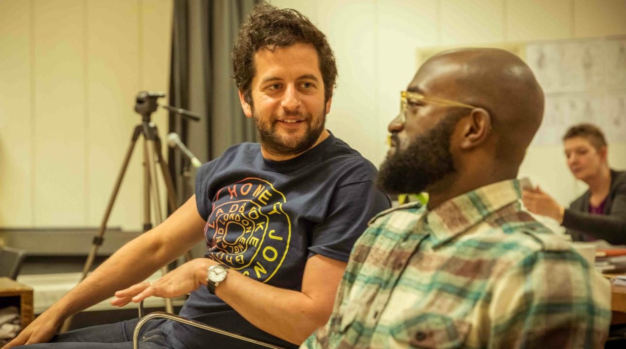 Bijan Sheibani and Inua Ellams in rehearsal for Barber Shop Chronicles.