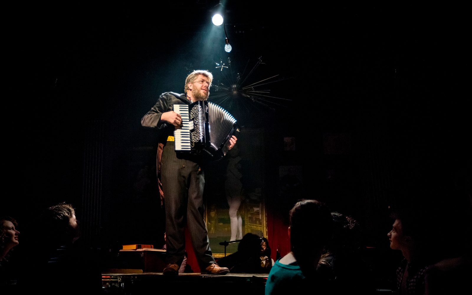 Dave Malloy playing the accordion as Pierre.