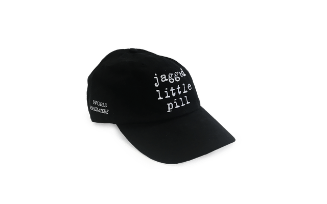 Black baseball cap with “Jagged Little Pill” on the front and “World Premiere” on the side.