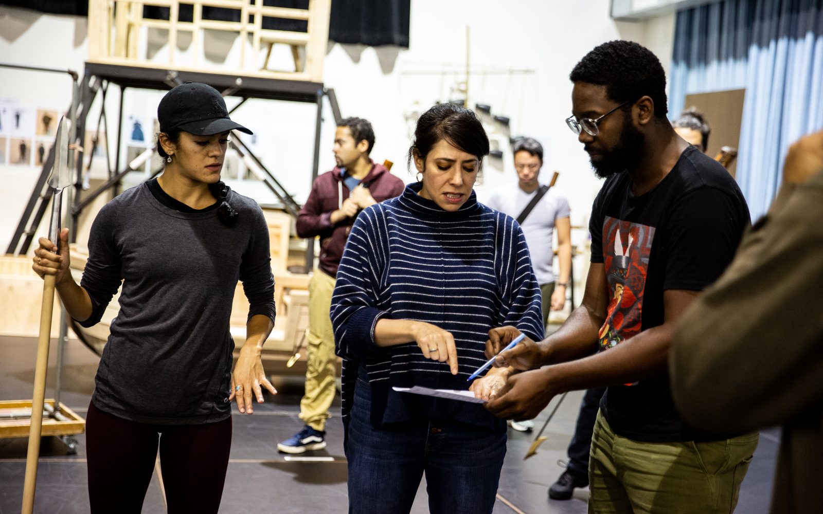 Kalyn West looks on as Rachel Chavkin and Eric Avery discuss the puppets of Moby-Dick in rehearsal.