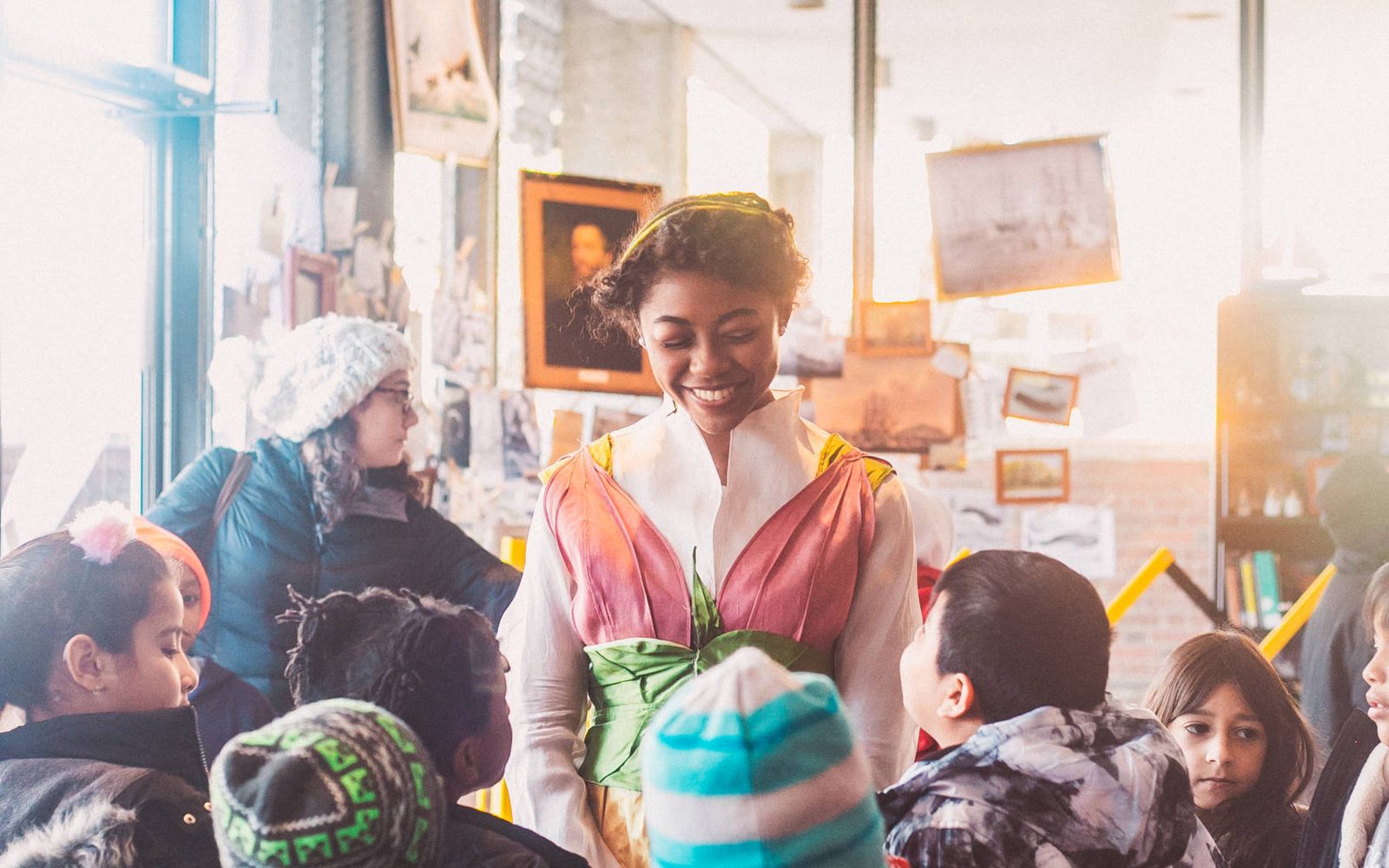 Janiah Lockett in Thumbelina with audience members.