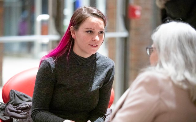 Audience members speaking to one another after Gloria: A Life.