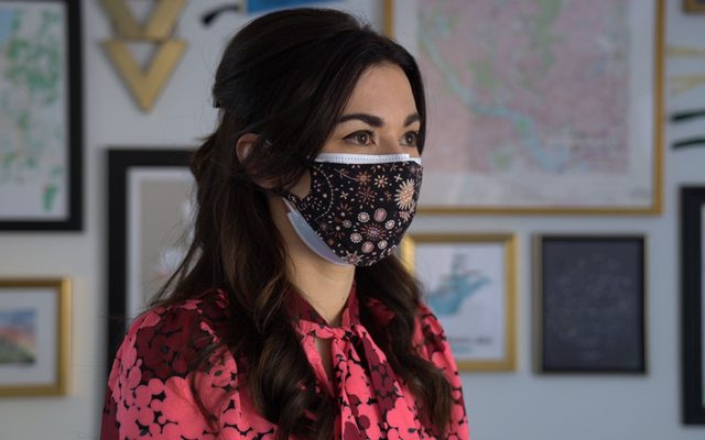 Woman wearing a mask.