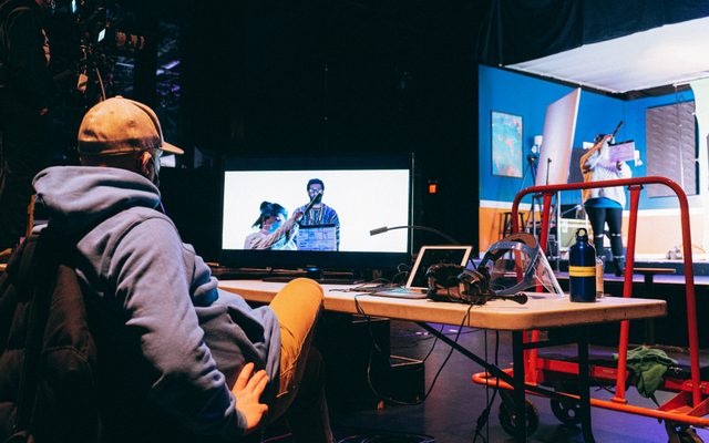 Original Stage Production Director and Co-Film Director Shawn LaCount prepares for capture of Kadahj Bennett (Verb) from one of the Director’s stations as Stage Manager Cesara Walters holds the clapboard.