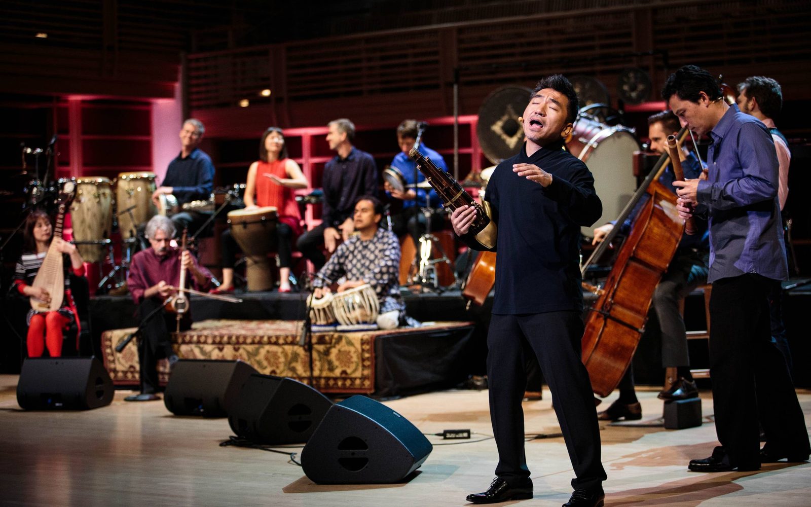 The Silkroad Ensemble in performance, with one man singing.