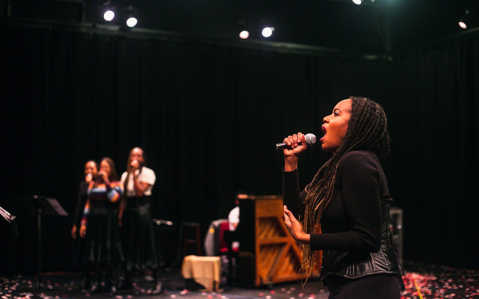 Phoenix Best, Kira Helper, Reggie D. White in the background with Whitney White in rehearsal.