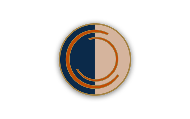 A blue and white enamel pin with The Conjurors’ Club logo of two interlocking Cs.