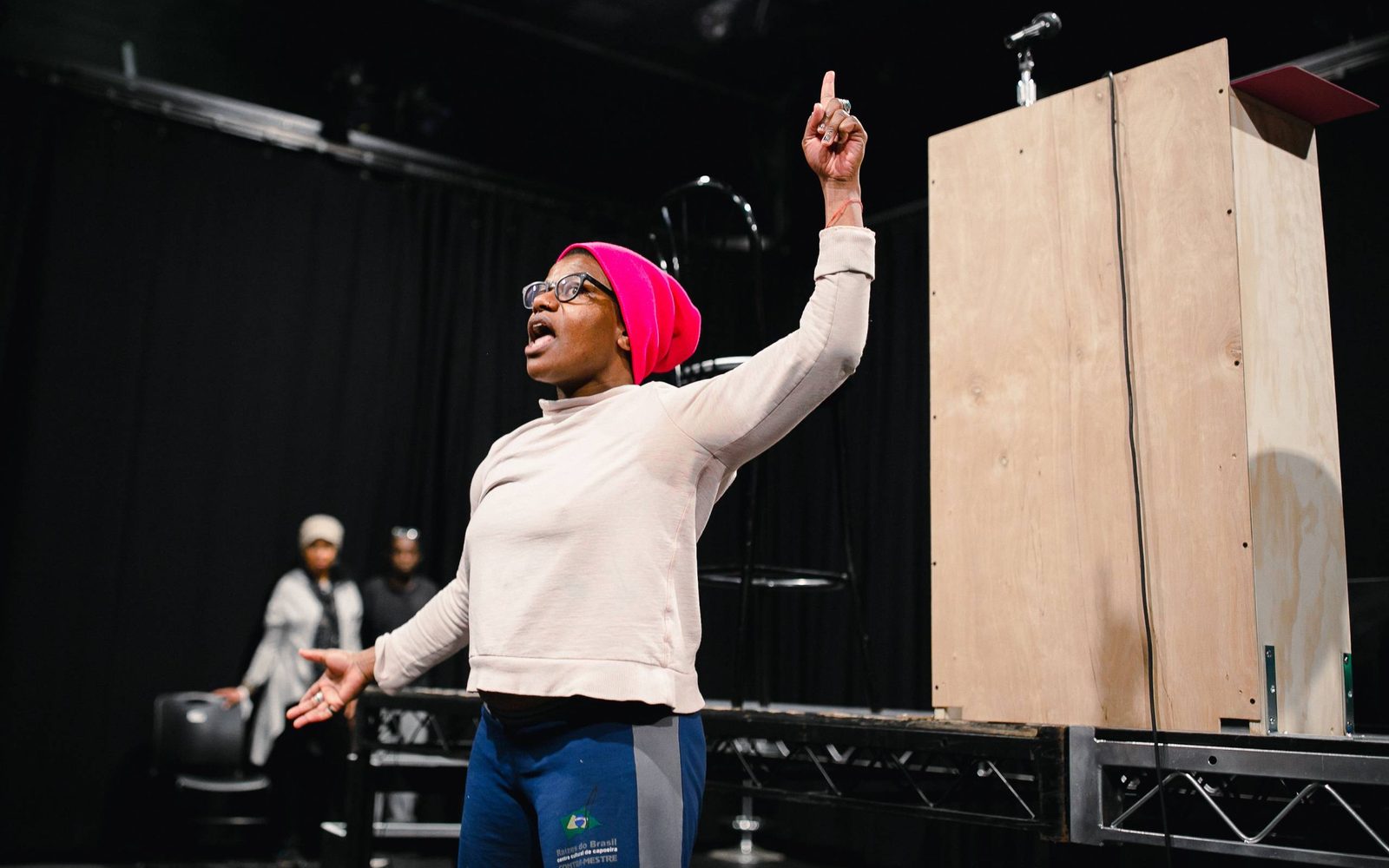 Jennifer Kidwell shouts and points her finger in the air in rehearsal.