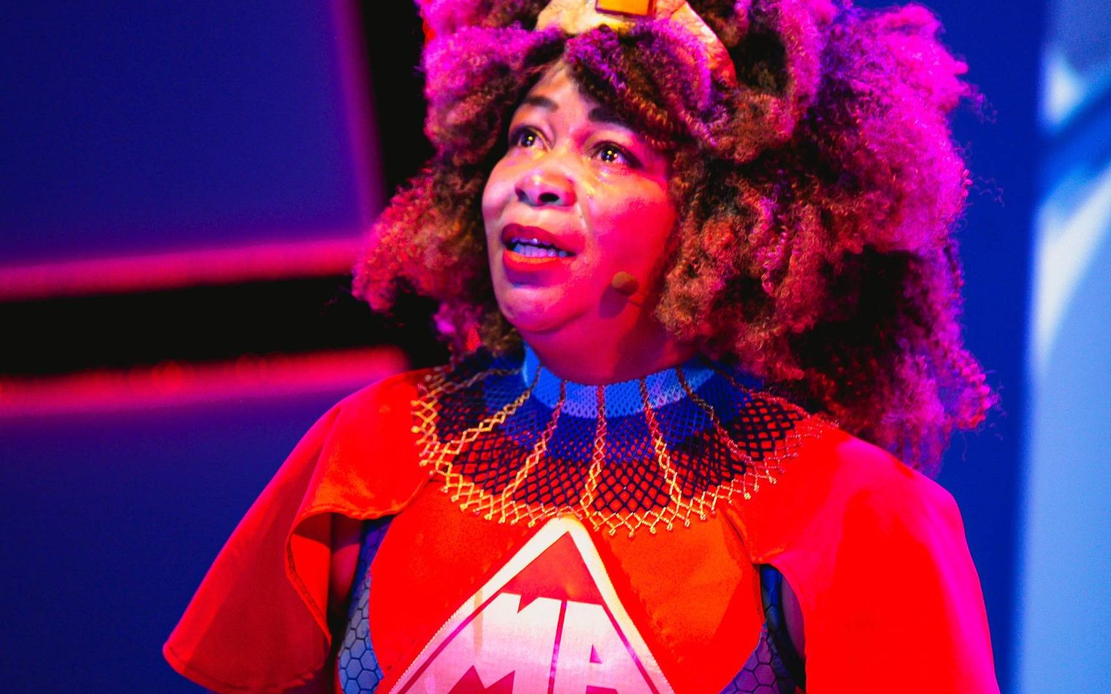 Ramona Lisa Alexander as the Maasai Angel in Black Super Hero Magic Mama.