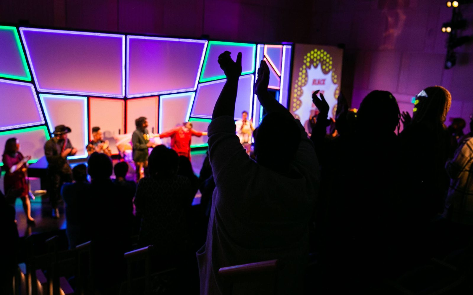 Audiences give a standing ovation for the cast of Black Super Hero Magic Mama.