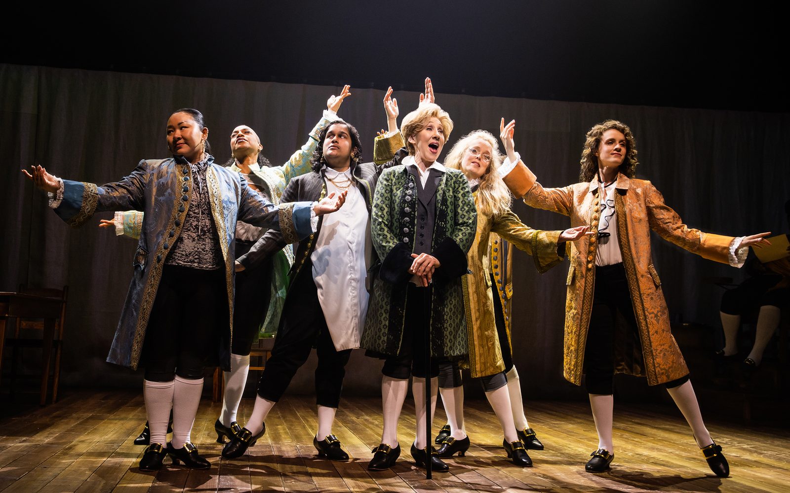Sara Porkalob, Oneika Phillips, Sushma Saha, Joanna Glushak, Nancy Anderson, and Eryn LeCroy standing and posing in a tableau.