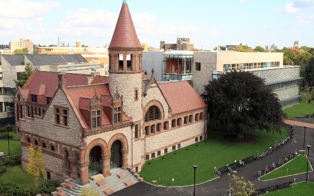 An aerial view of the main Cambridge Public Library, with the 1889 building in the foreground, and the 2009 addition in the background.