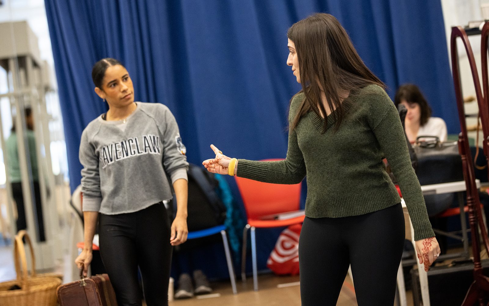 Director Sammi Cannold turns to speak to Ilda Mason behind her.