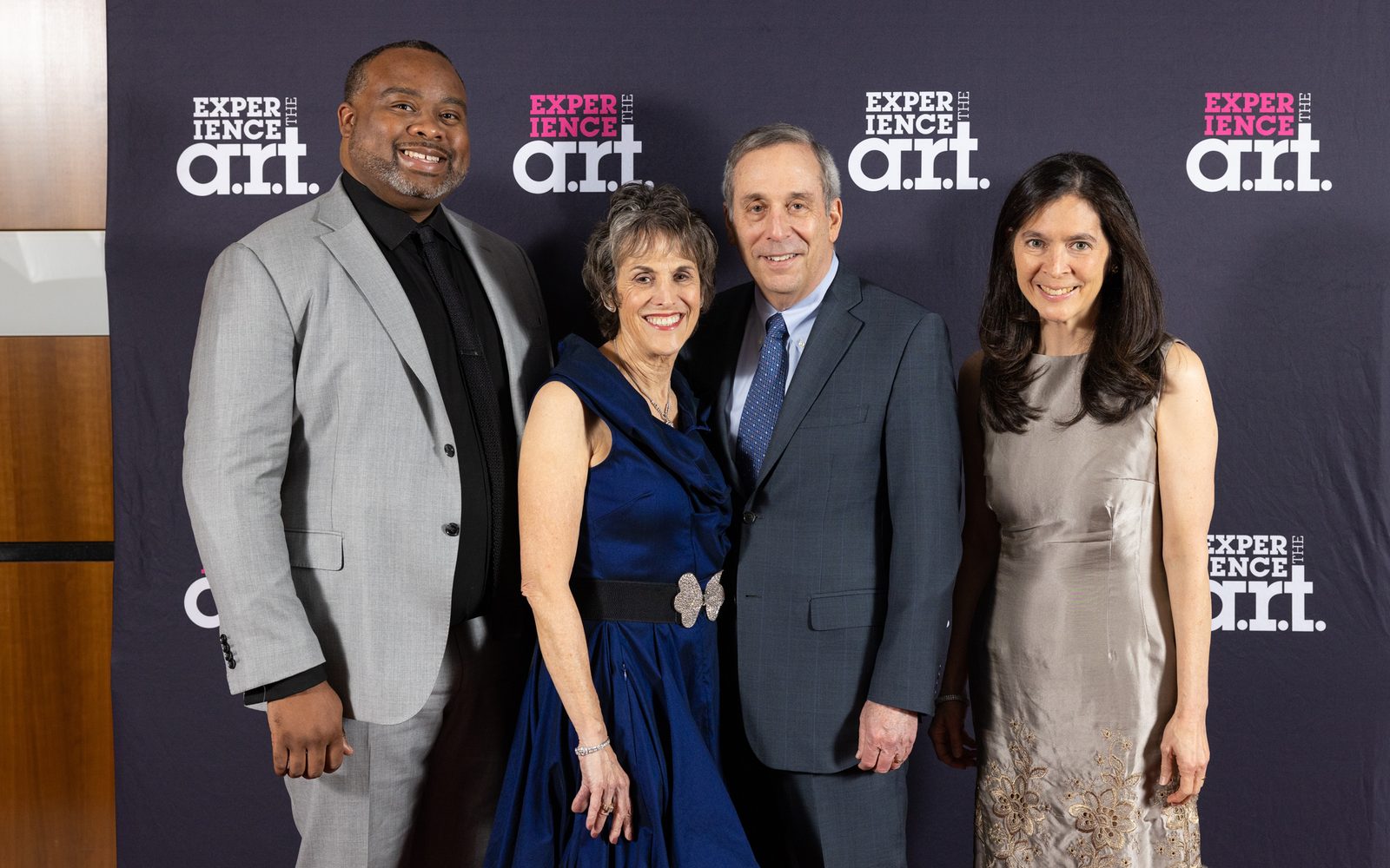 Kelvin Dinkins, Jr., Adele Fleet Bacow, Lawrence S. Bacow, and Diane Paulus stand together smiling.