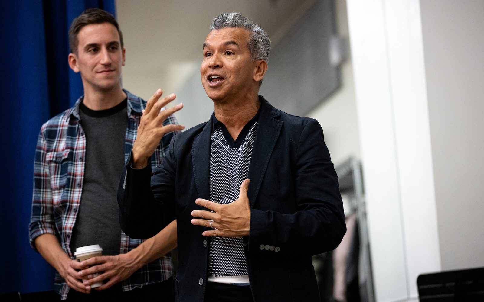 Sergio Trujillo talks to the cast with his assistant Alex Tobey behind him.