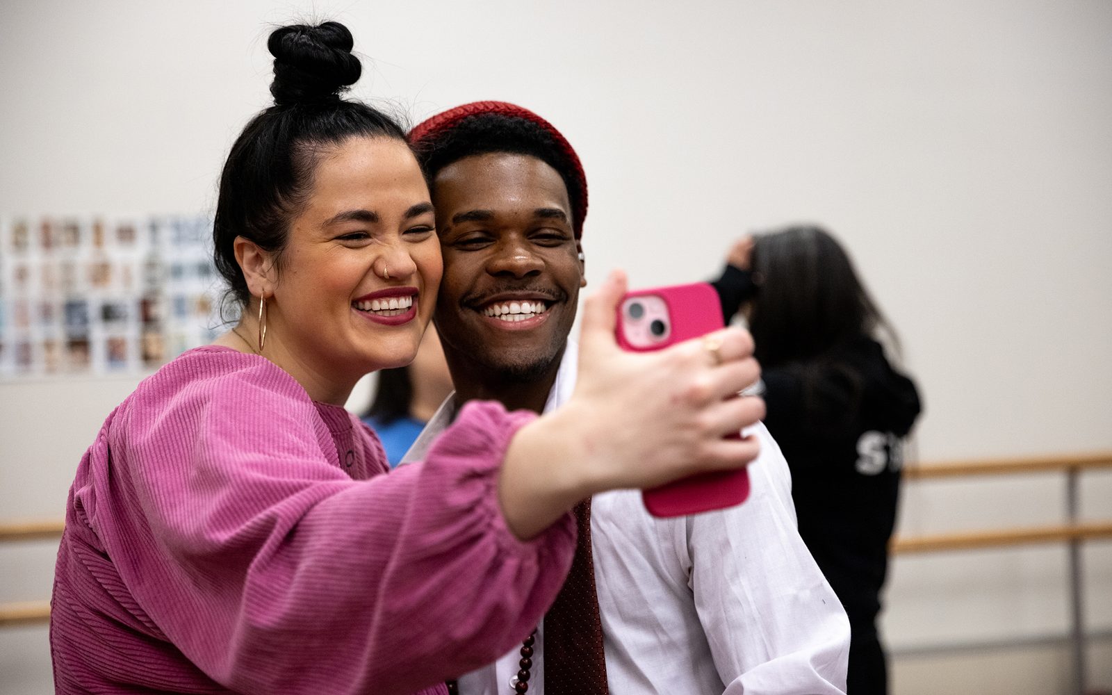 Lucy Godínez holds up her phone to take a selfie with Sage.