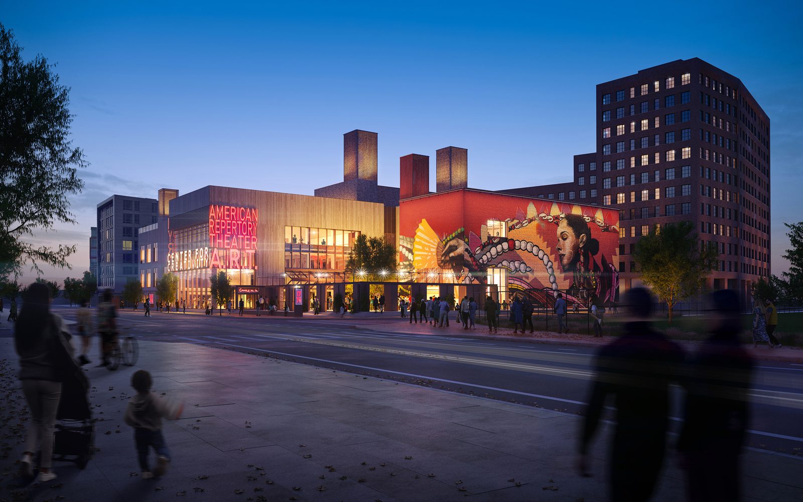 The exterior at night, with a large mural on the wall to the right.