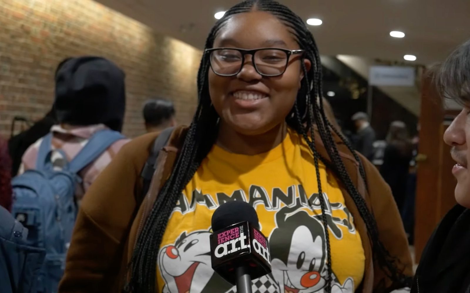A young audience member smiling after seeing the show.