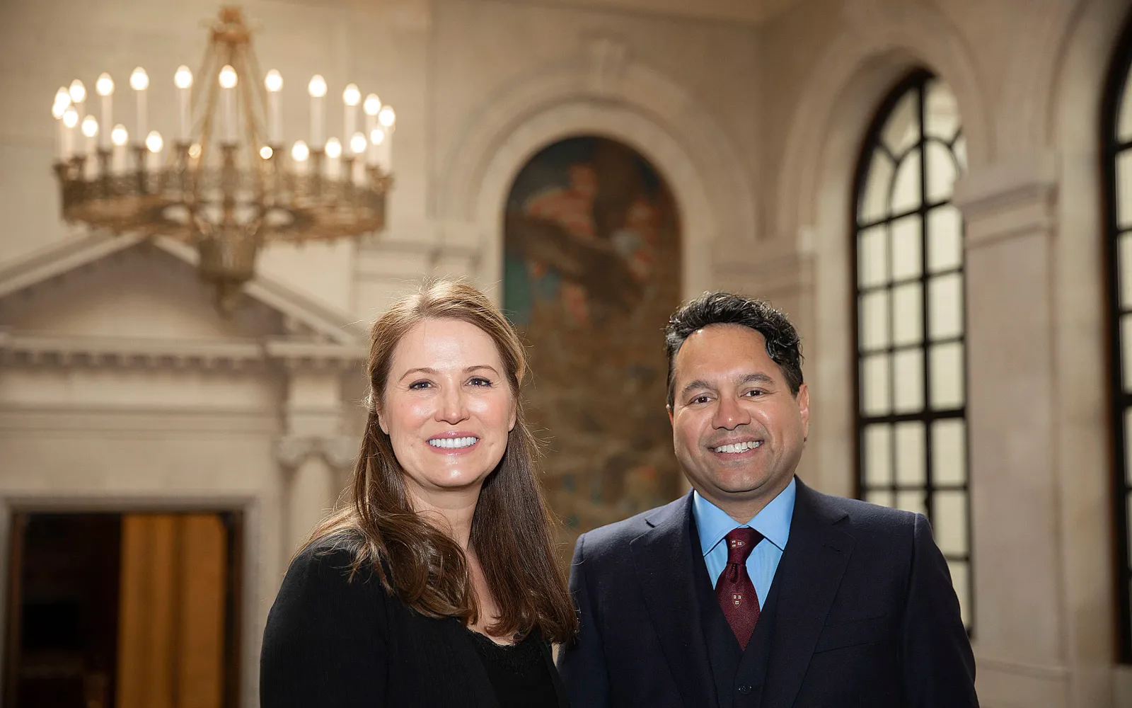 Stacey Goel and David Goel ’93 in the Widener Library in Harvard Yard.