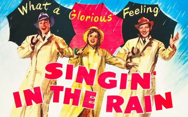 Illustrated poster for Singin’ in the Rain showing the three main actors in yellow raincoats and umbrellas.