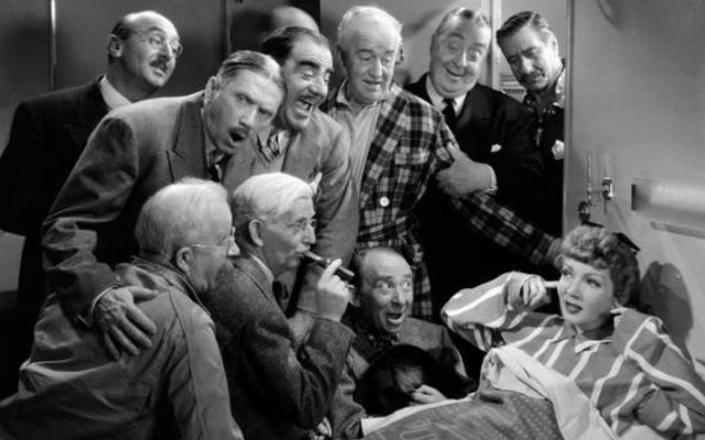 Still from The Palm Beach Story with several men crammed into a sleeper cabin singing to a woman plugging her ears.