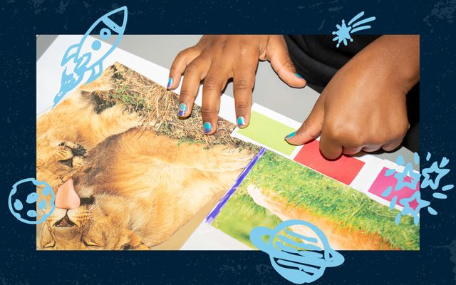 A Black child’s hands paste a yellow rectangle on a collage that includes a pair of lions grooming.